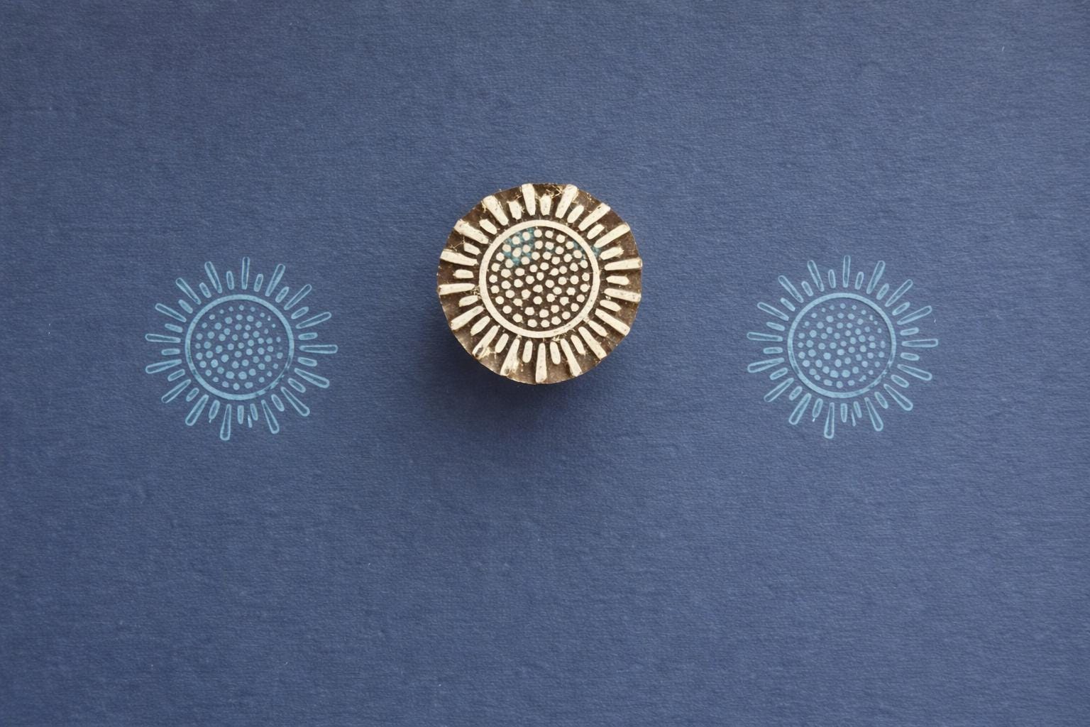 Hand carved sunburst wooden block printing stamp used for textile printing, fabric stamping, pottery and clay crafts.