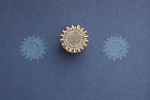 Hand carved sunburst wooden block printing stamp used for textile printing, fabric stamping, pottery and clay crafts.