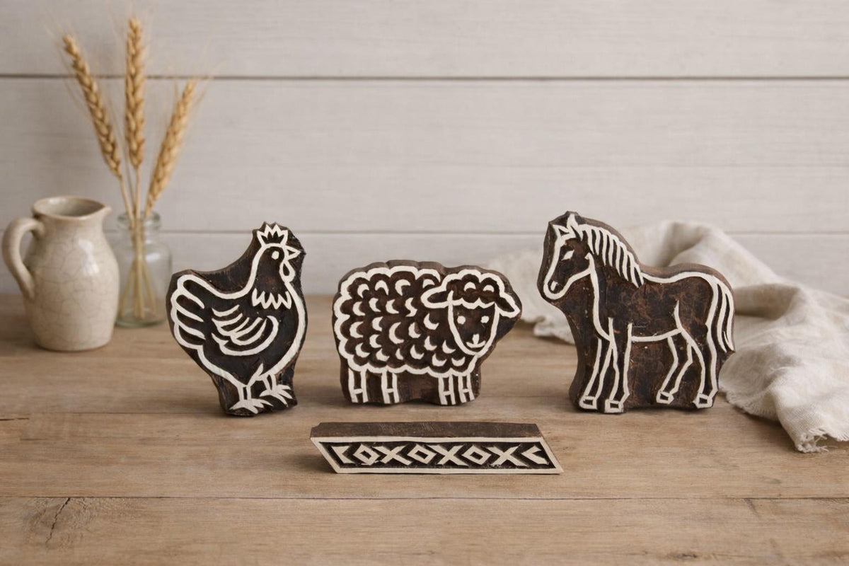 Hand carved wooden block printing stamps featuring chicken, sheep, horse and geometric border for fabric printing, pottery, clay and textile crafts.