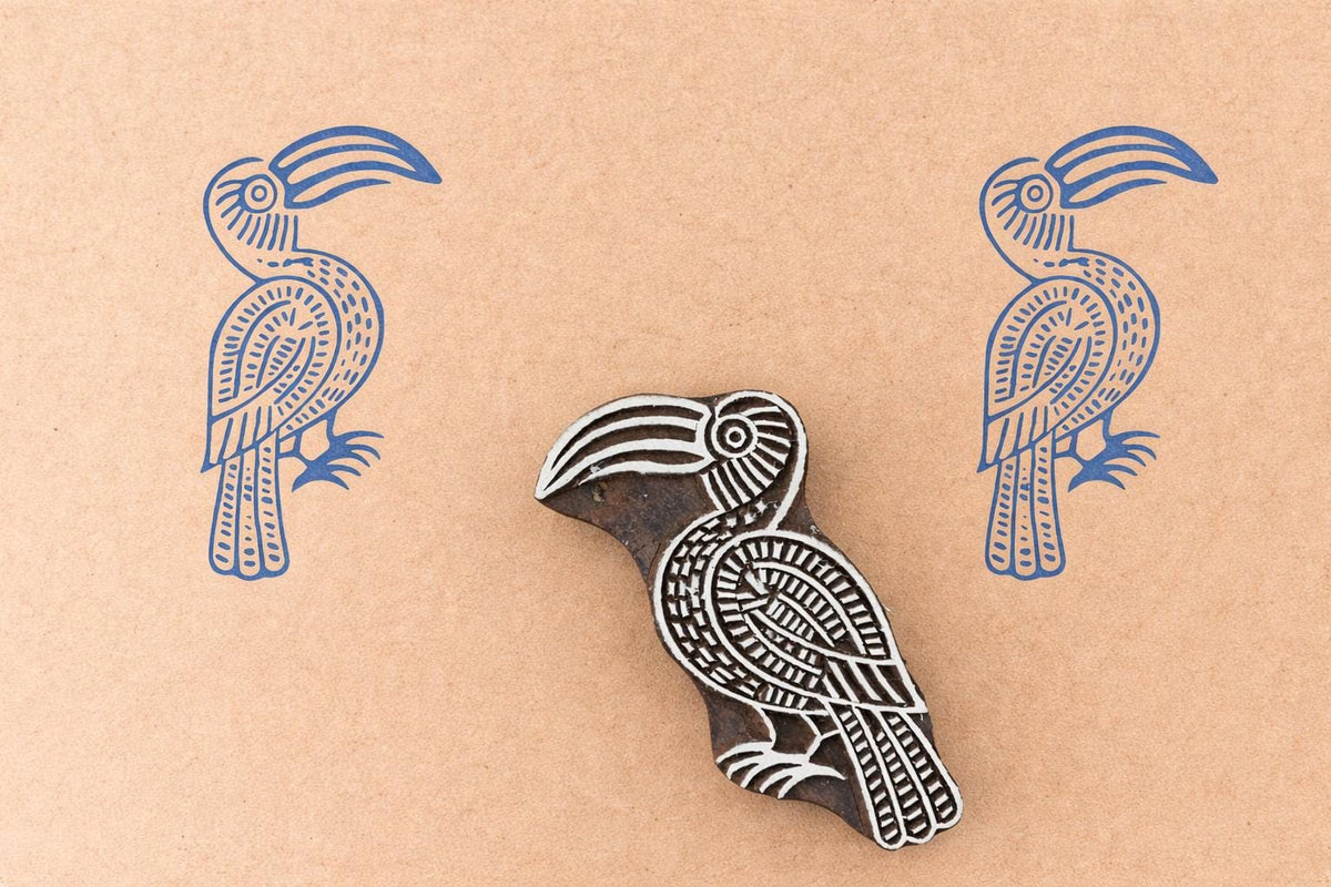 Hand carved toucan bird wooden block printing stamp used for textile printing, fabric stamping and pottery decoration.