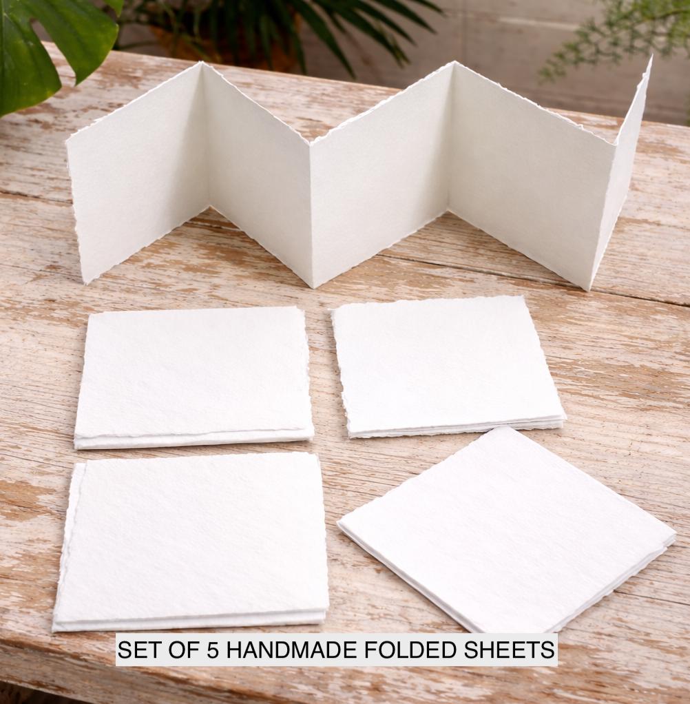 Stack of handmade off-white deckle edge paper sheets set of 5 in a pack
