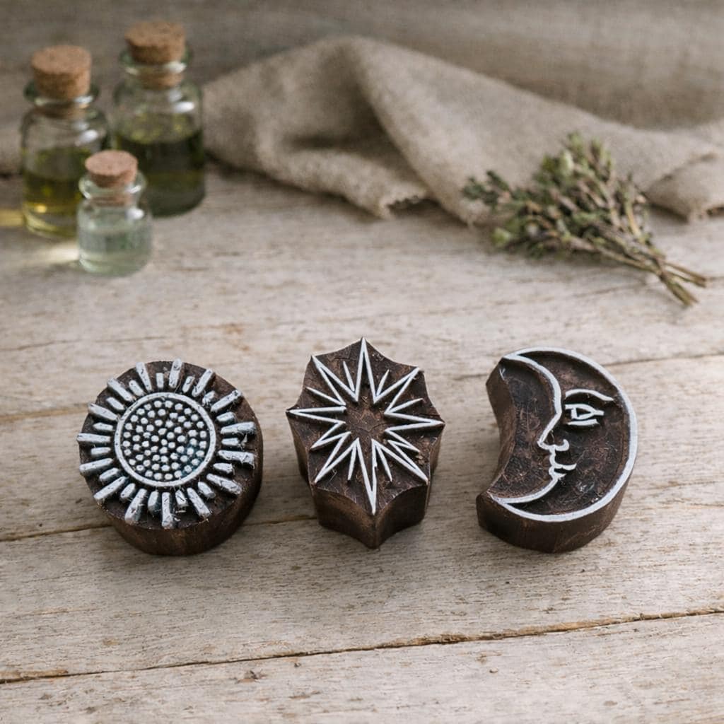 Hand carved Indian wooden block printing stamps featuring sun, starburst and crescent moon face designs for textile, fabric, clay and pottery printing.