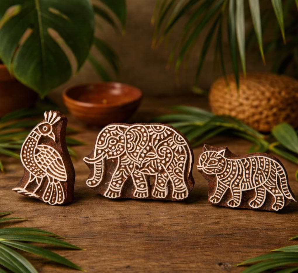 Hand carved wooden block printing stamps featuring elephant, bird and tiger designs for fabric printing, pottery, textile crafts and block printing.