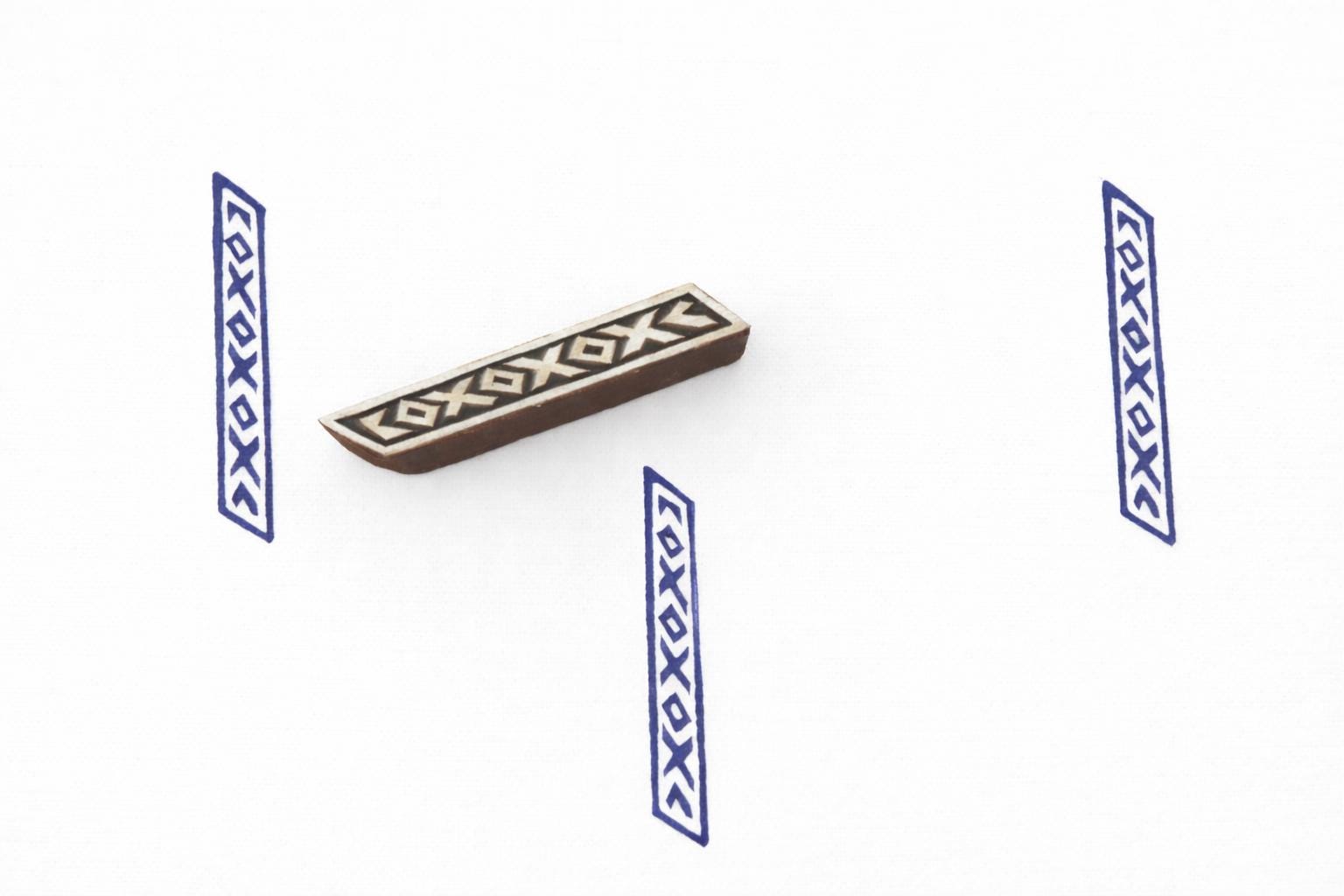 Hand carved geometric border wooden block printing stamp used for fabric printing, pottery decoration and textile patterns.