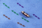 Hand carved arrow stamp used to print multicolor arrow patterns on textured blue paper.