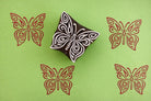 lacewing butterfly stamp with red ink prints on green background