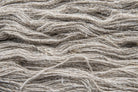 Texture detail of natural nettle yarn fibers sourced from the Himalayan foothills.