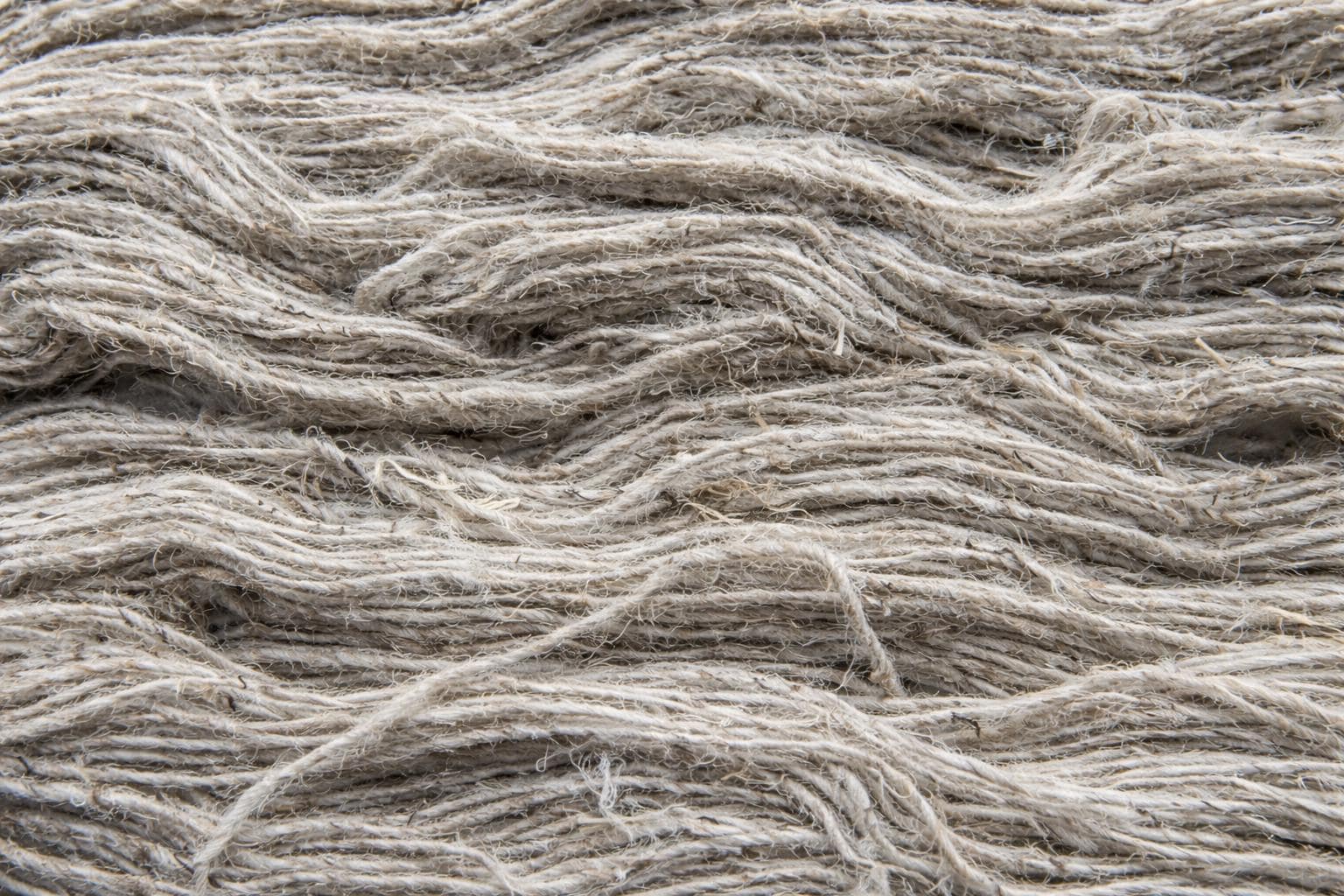 Texture detail of natural nettle yarn fibers sourced from the Himalayan foothills.