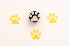 Paw wooden block printing stamp used on fabric and clay showing yellow prints pottery and textile stamp