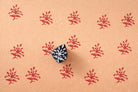 Hand carved Indian flower wood stamp printing red pattern on handmade paper