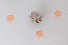 Hand carved lotus mini stamp printing orange floral pattern on fabric