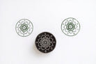 Hand carved wooden round stamp printing floral mandala with symbol pattern