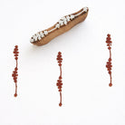 Hand carved wooden stamp printing small vertical floral strip border pattern