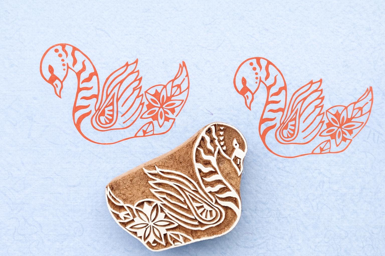 Hand carved swan wood block stamp with floral detail printed on fabric