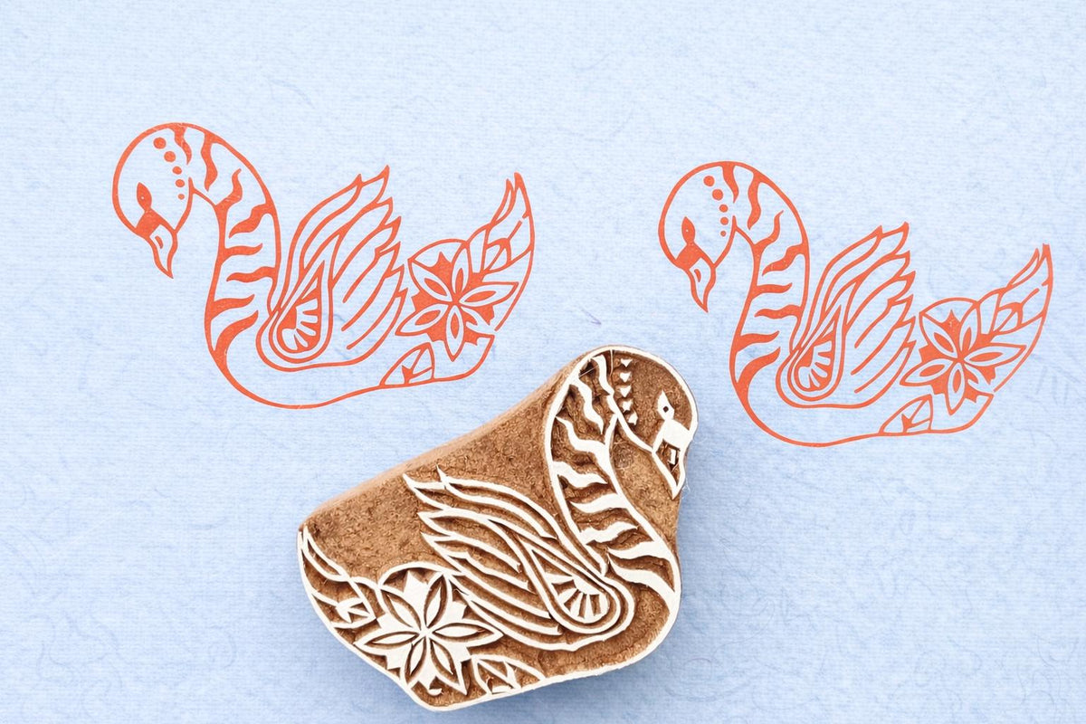 Hand carved swan wood block stamp with floral detail printed on fabric