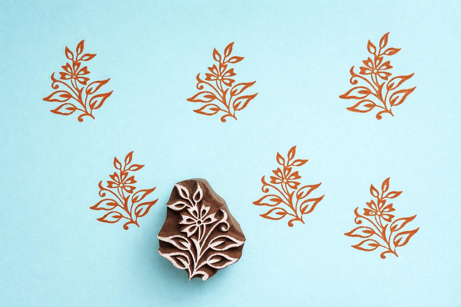 Small wooden block printing stamp with floral petal design for fabric and textile printing