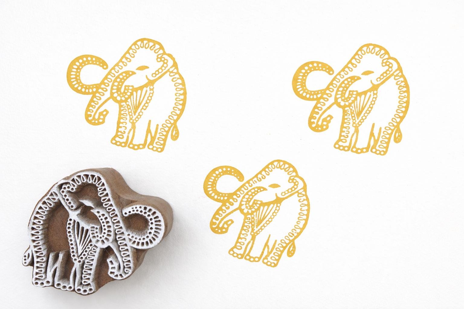 Traditional Indian elephant wood block stamp with gold print pattern