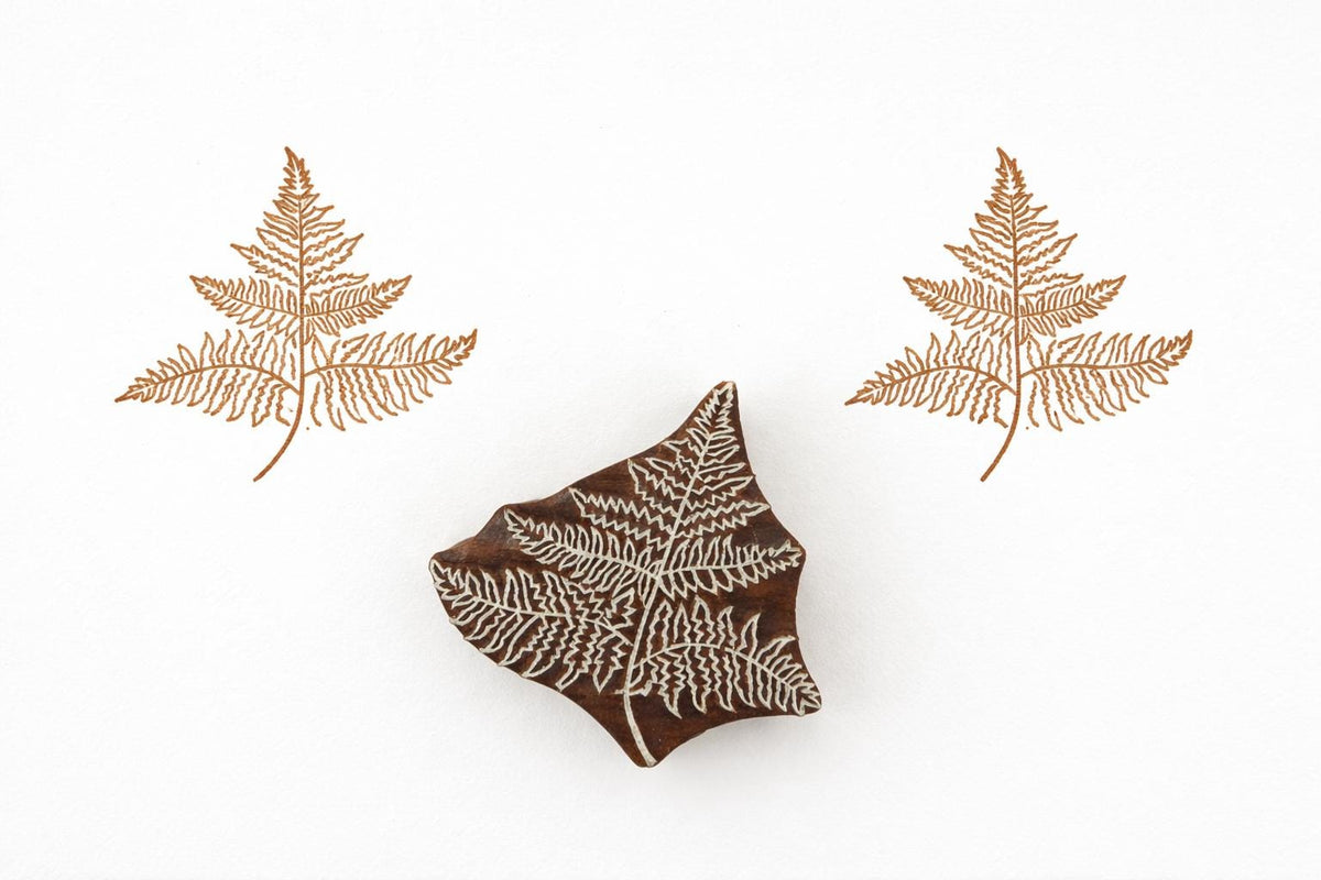 Hand carved fern leaf wood block stamp creating a botanical print on paper or fabric