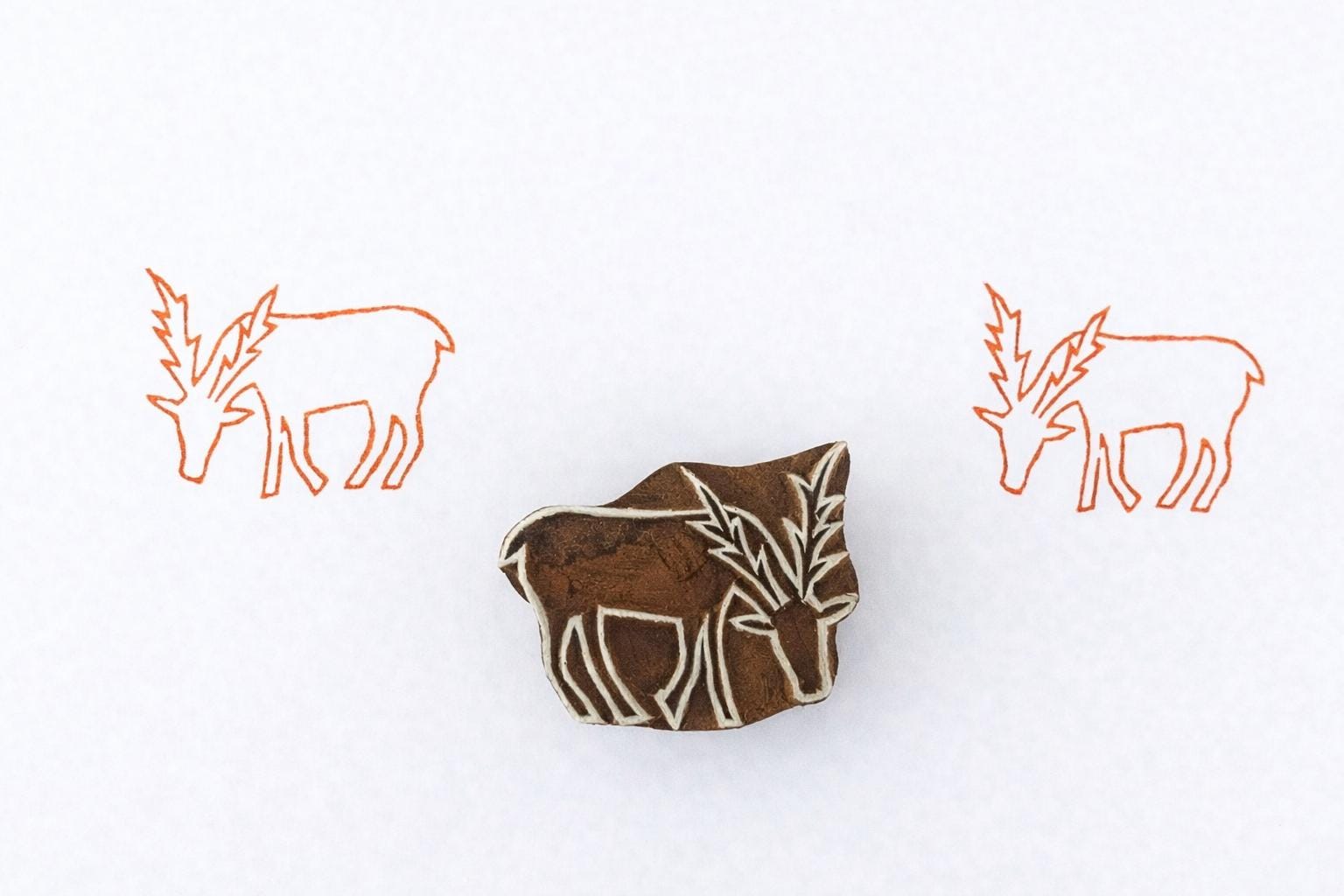 Hand carved wooden deer stamp for block printing on fabric and paper