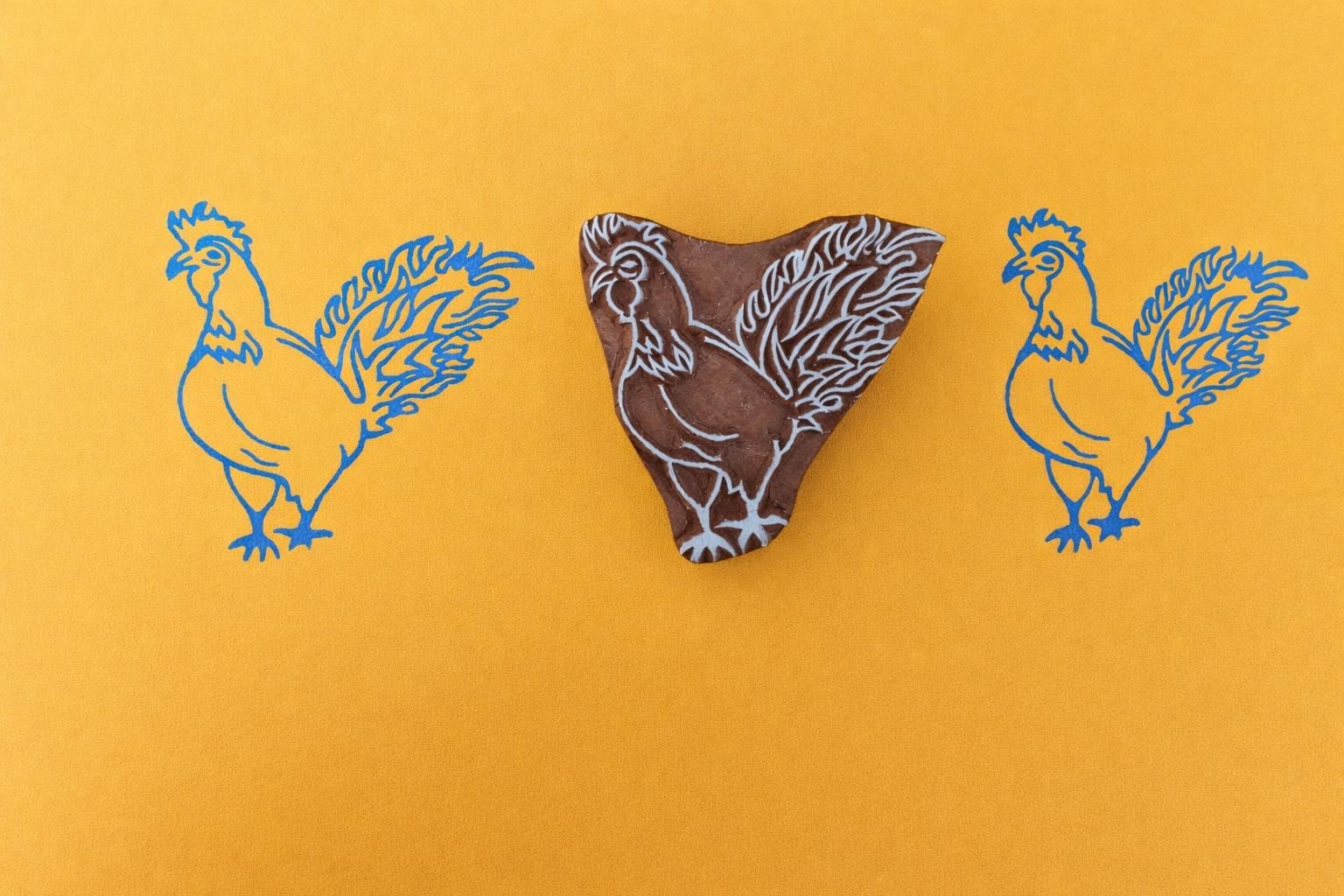 Hand carved wooden block printing stamp with rooster chicken design for fabric printing, farmhouse crafts, and pottery