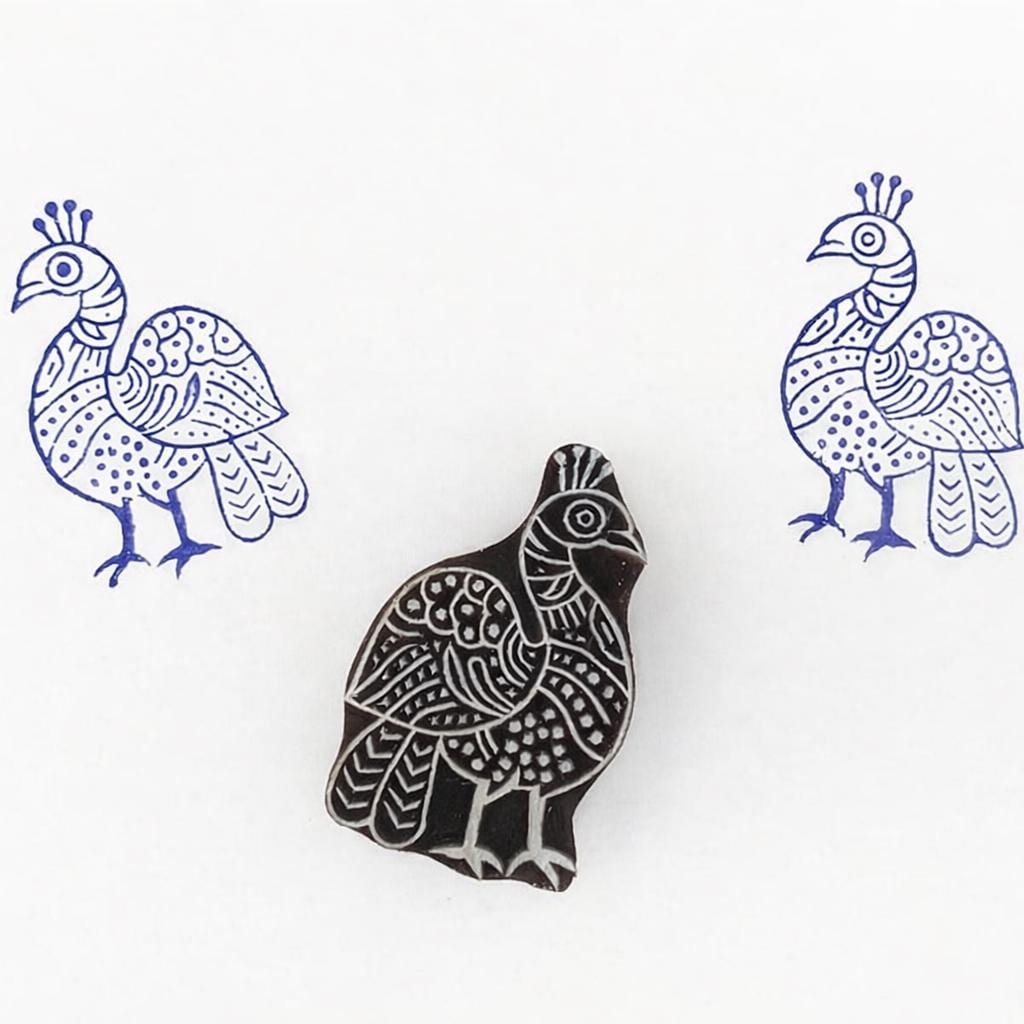 Hand carved wooden printing stamp with peacock bird design for fabric printing, textile patterns, and clay pottery