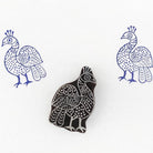 Hand carved wooden printing stamp with peacock bird design for fabric printing, textile patterns, and clay pottery