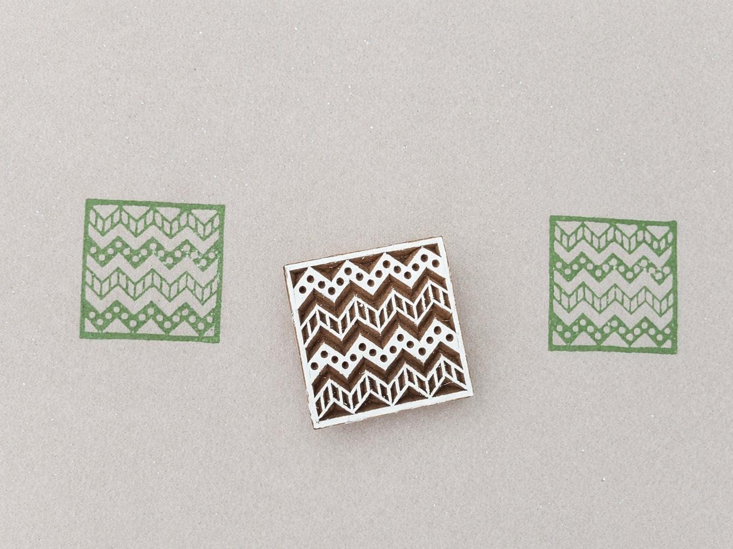 Hand carved wooden block with geometric chevron and border pattern used for fabric and textile printing