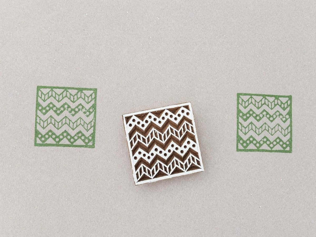 Hand carved wooden block with geometric chevron and border pattern used for fabric and textile printing