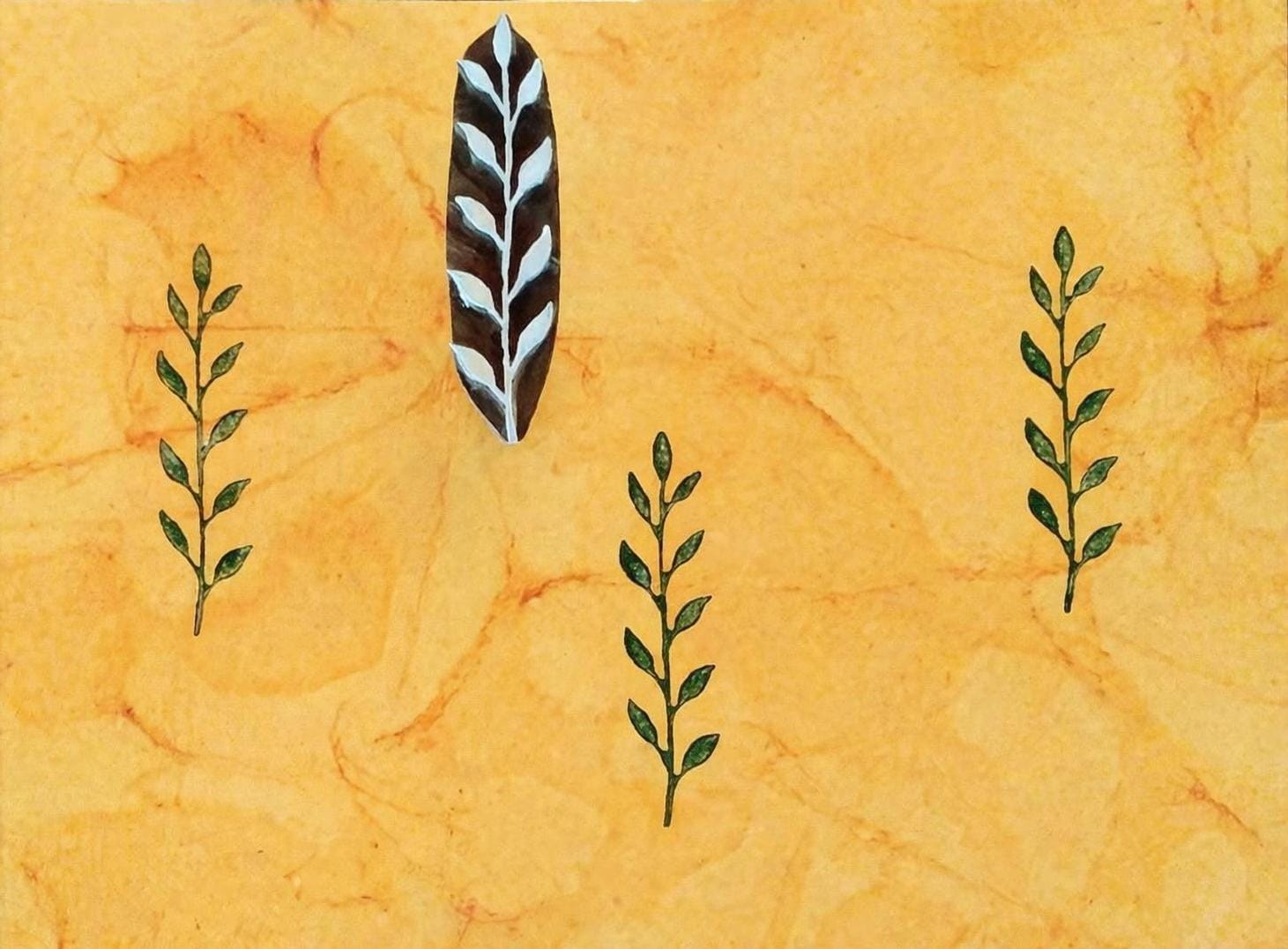 Hand carved long botanical leaf stamp with repeating green prints on textured background