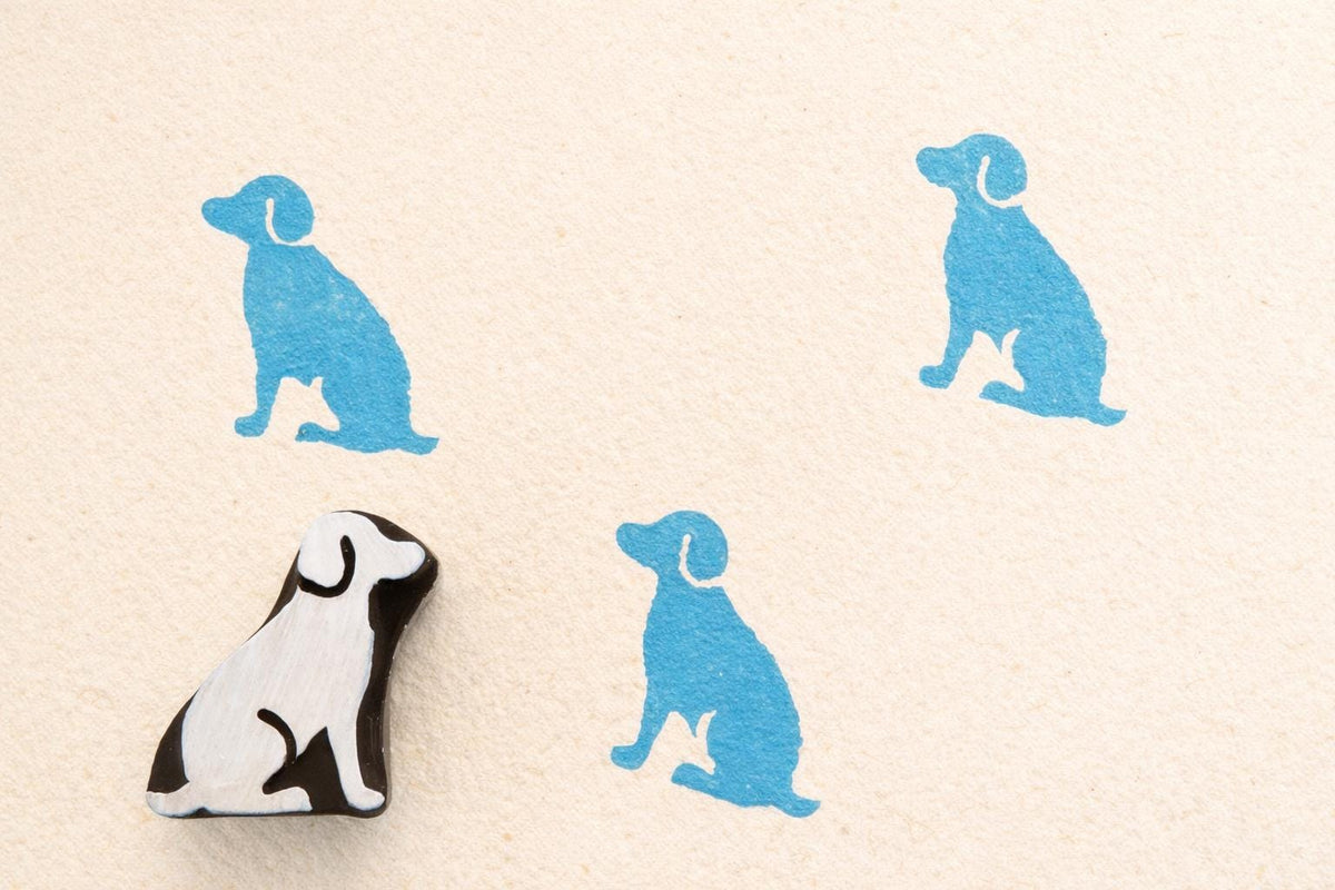 Dog wooden printing stamp used on fabric showing blue textile prints block printing stamp for fabric crafts