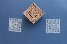 Hand carved wooden square stamp printing sun motif with decorative border