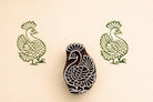 Peacock wooden textile stamp used on fabric showing green block print design Indian printing block