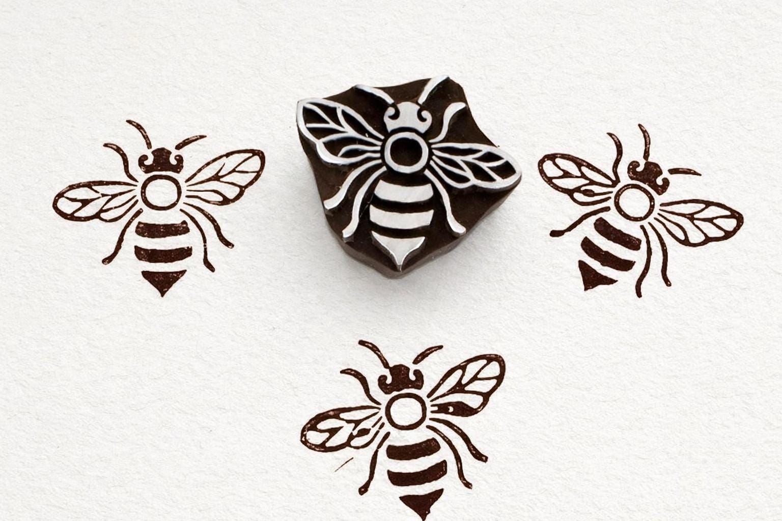 Bee wooden printing stamp used for fabric and clay printing showing brown textile prints block stamp