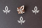 Wooden block stamp with simple leaf sprig design for fabric printing
