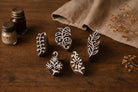 Indian wooden printing blocks set featuring Curved Vine Leaf Block Dense Fern Leaf Block Twin Stem Leaf Block Wildflower Stem Block and Daisy Bloom Block for fabric and textile printing