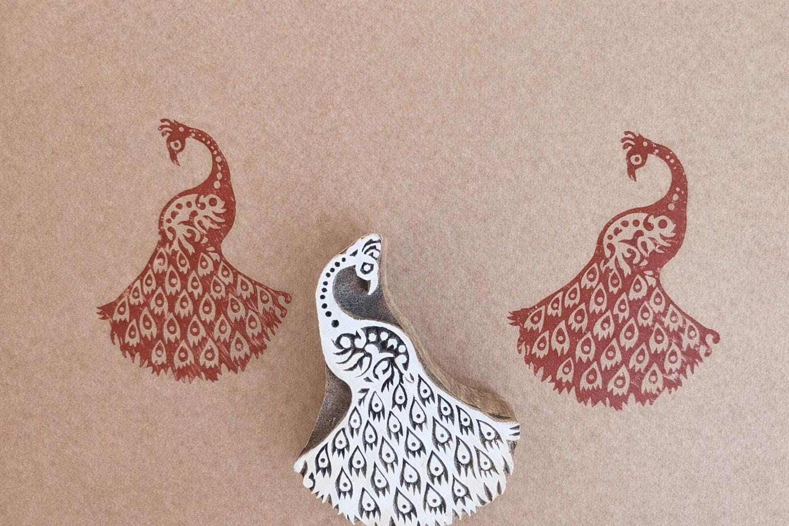 Peacock Feather Block wooden stamp with detailed feather pattern printed in red