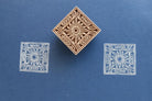 Hand carved wooden square stamp printing sun motif with decorative border