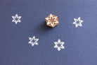 Hand carved wooden stamp with star shaped flower design