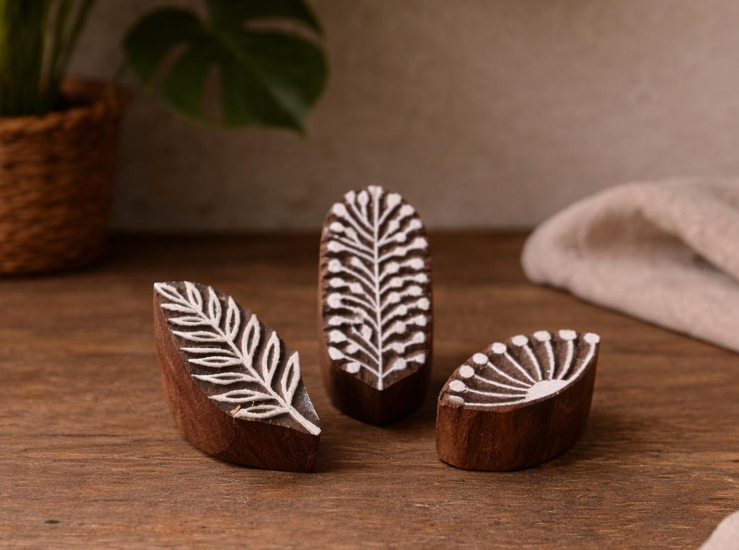 Set of three handmade wooden mini block print stamps with fern leaf, branch, and fan palm patterns
