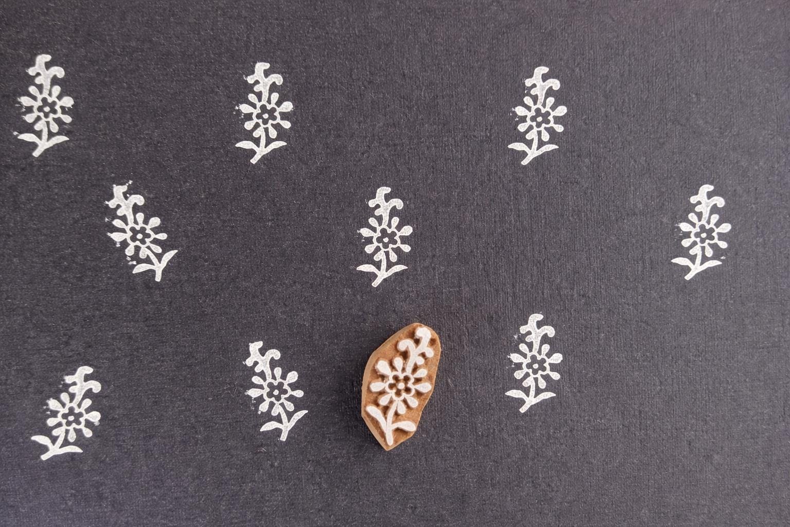 Hand carved wooden stamp with daisy flower and stem design