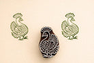 Peacock wooden textile stamp used on fabric showing green block print design Indian printing block