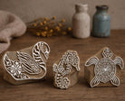 Hand carved wooden stamp set featuring swan, seahorse and turtle designs for block printing on fabric and paper