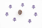 Hand carved daisy flower stamp used for block printing on paper