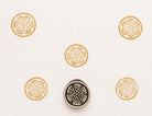 Citrus slice stamp creating repeating orange slice pattern on paper