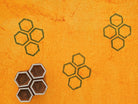 Honeycomb hexagon pattern printed with handmade wood stamp in ink on textured paper