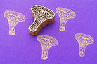 Chanterelle mushroom wood block stamp creating repeating print pattern