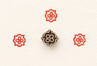 Small hand carved wooden printing stamp with floral design for fabric printing, textile patterns, and clay pottery