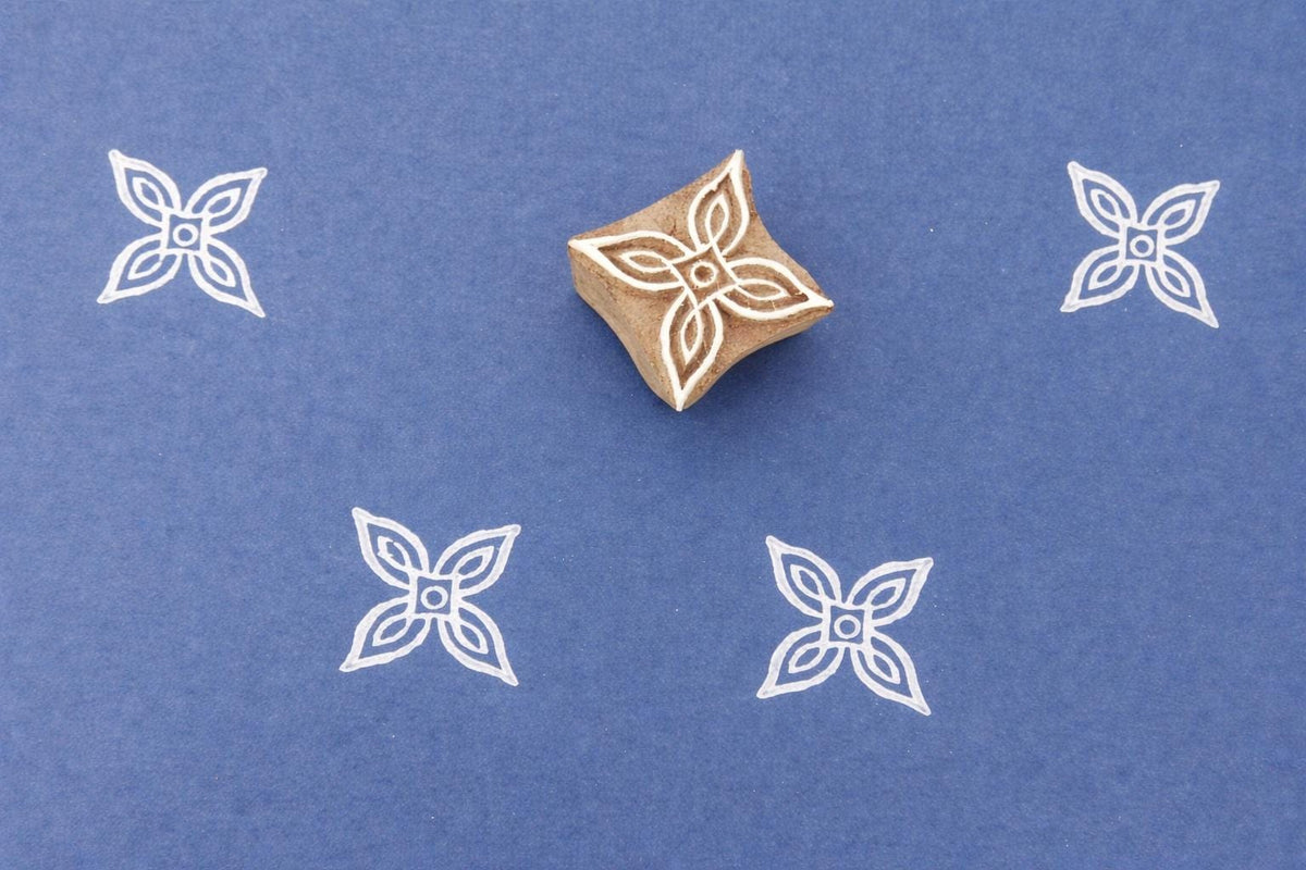 Hand carved wooden printing stamp with geometric floral pattern for fabric printing, textile design, and clay pottery