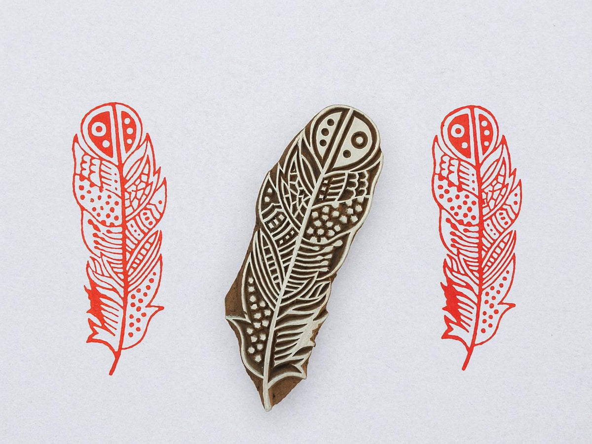 Hand carved wooden printing block with detailed feather design for fabric and textile printing