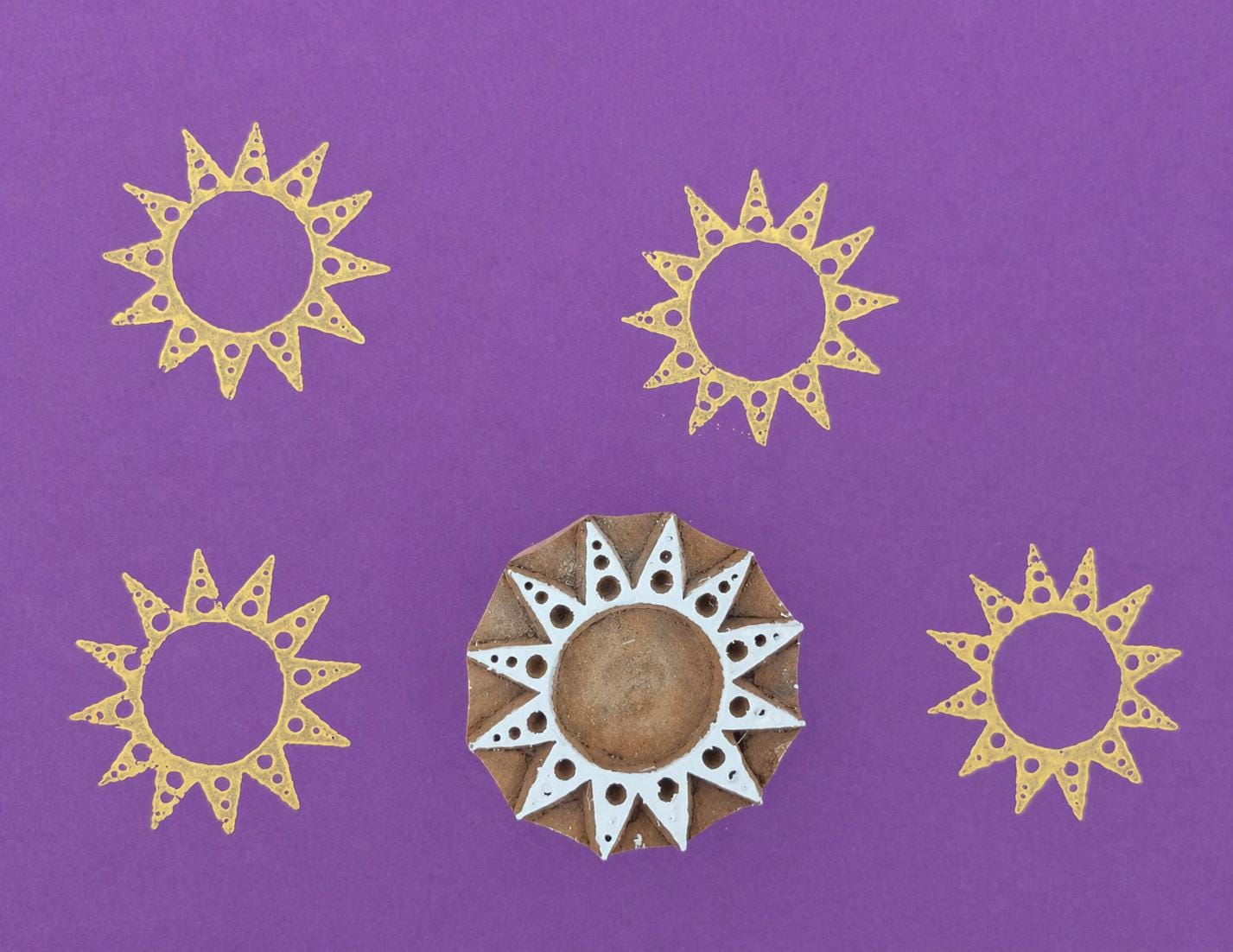 Hand carved wooden printing stamp with sun halo geometric design for fabric printing, textile patterns, and clay pottery